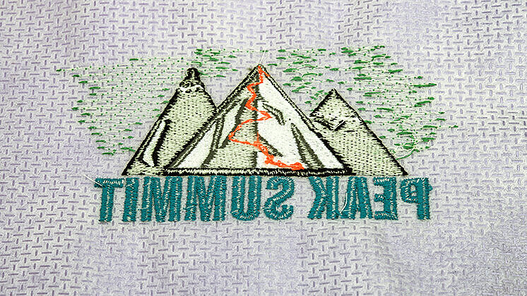 [Translate to Hongkong (Englisch):] Back side of an embroidery with understitches and backing