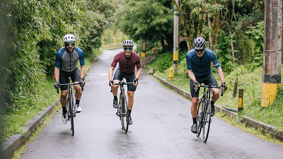 3 men cycling in sportswear
