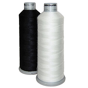 [Translate to Hongkong (Englisch):] Black and white aramid bobbin thread cones