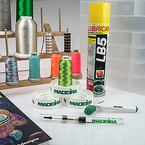Embroidery accessories like cone plate, adhesive spray, punch book and more