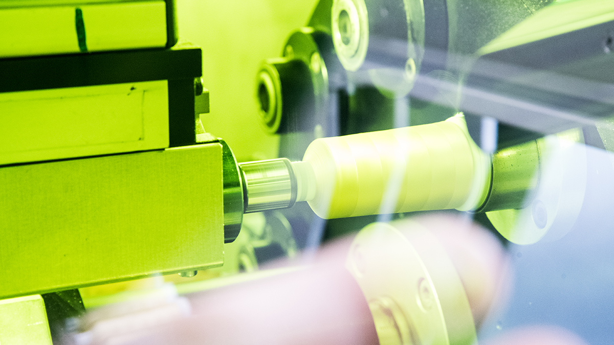 [Translate to Hongkong (Englisch):] Madeira thread production showing a high performance spooling machine