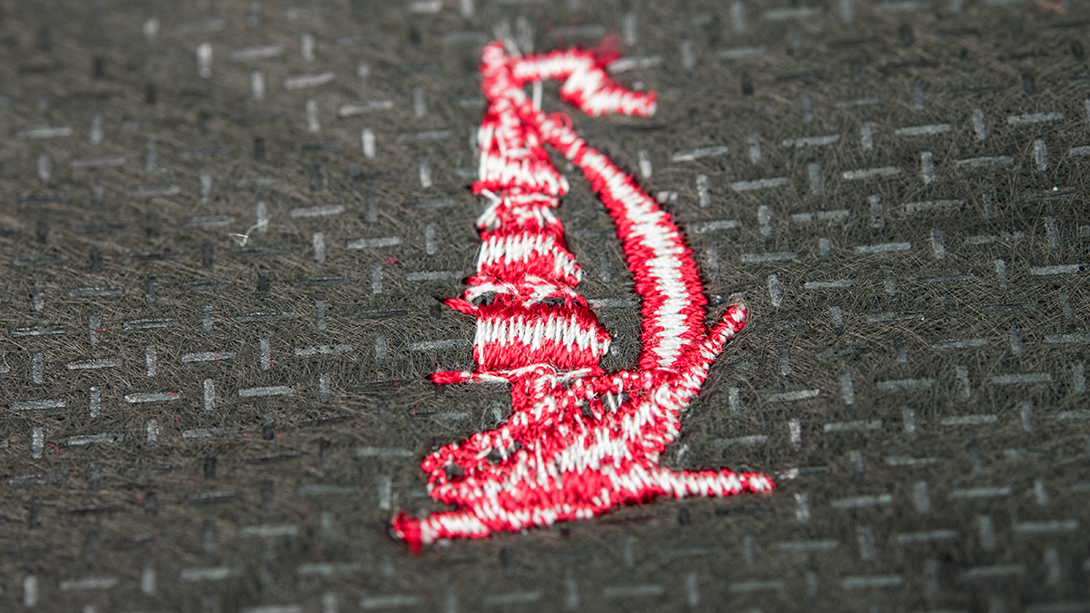 [Translate to Hongkong (Englisch):] Backside of an embroidery with white underthread