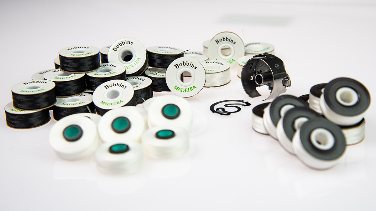 [Translate to Hongkong (Englisch):] Assortment of pre-wound embroidery underthread bobbins