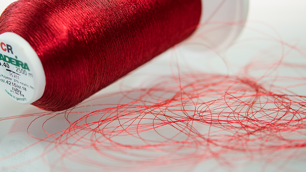 [Translate to Hongkong (Englisch):] red metallic embroidery thread cone - CR Metallic