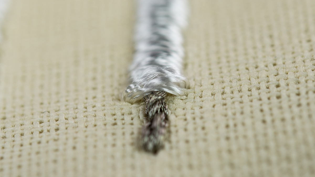 [Translate to Hongkong (Englisch):] conductive thread with isolating viscose thread